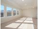 Bright, spacious bonus room with large windows and neutral carpeting at 10509 Boudreaux St, Huntersville, NC 28078