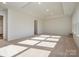 Bright, airy bonus room with carpeted floors and natural light at 10509 Boudreaux St, Huntersville, NC 28078