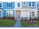 Townhome entry featuring a purple door and stone accents at 10509 Boudreaux St, Huntersville, NC 28078