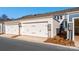 Attached garages with white doors and landscaping at 10509 Boudreaux St, Huntersville, NC 28078