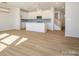 Open concept kitchen with island and stainless steel appliances at 10509 Boudreaux St, Huntersville, NC 28078