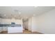 Modern kitchen with white cabinets and an island at 10509 Boudreaux St, Huntersville, NC 28078