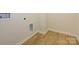 Convenient laundry room with vinyl flooring and built-in shelving at 10509 Boudreaux St, Huntersville, NC 28078