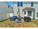 Private backyard with patio, grill, and seating area at 11407 Sidney Crest Ave, Charlotte, NC 28213
