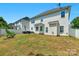Large backyard with patio, grill, and home view at 11407 Sidney Crest Ave, Charlotte, NC 28213