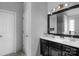 Main bathroom with double vanity and dark cabinets at 11407 Sidney Crest Ave, Charlotte, NC 28213