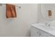 Small bathroom with white vanity and oval mirror at 11407 Sidney Crest Ave, Charlotte, NC 28213