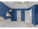 Blue-walled bedroom with a view of another room at 11407 Sidney Crest Ave, Charlotte, NC 28213