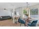 Bright dining area with table and chairs, adjacent to living room at 11407 Sidney Crest Ave, Charlotte, NC 28213