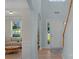 Two story entryway with light walls and view of living room at 11407 Sidney Crest Ave, Charlotte, NC 28213