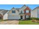 Two story brick and siding home with two car garage at 11407 Sidney Crest Ave, Charlotte, NC 28213