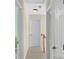 Upper hallway with wood railing and neutral decor at 11407 Sidney Crest Ave, Charlotte, NC 28213
