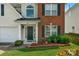 Inviting front entrance with landscaping and brickwork at 11407 Sidney Crest Ave, Charlotte, NC 28213