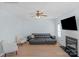 Living room featuring a sectional sofa and fireplace at 11407 Sidney Crest Ave, Charlotte, NC 28213