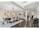 Formal dining room featuring a large table, elegant chandelier, and seamless flow to other living spaces at 1809 Cavaillon Dr, Waxhaw, NC 28173