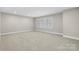 Large empty room with a large window offering plenty of natural light at 1809 Cavaillon Dr, Waxhaw, NC 28173