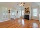 Spacious living room with hardwood floors, fireplace, and lots of natural light at 3624 Ramsey Rd, Sharon, SC 29742