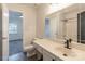 Well-lit bathroom with a vanity, mirror, toilet, and a shower-tub combo at 6427 Saint Bernard Way, Charlotte, NC 28269