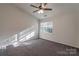 Bright bedroom featuring neutral walls, soft carpeting, and a window offering natural light at 6427 Saint Bernard Way, Charlotte, NC 28269