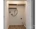 Storage closet space with shelving and connections for a washer and dryer unit at 6427 Saint Bernard Way, Charlotte, NC 28269