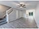 Open-concept living space with hardwood floors, staircase, and ample natural light at 6427 Saint Bernard Way, Charlotte, NC 28269