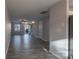 Spacious living area with hardwood floors, a staircase, and views to the front yard at 6427 Saint Bernard Way, Charlotte, NC 28269