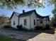 White sided house with a dark gray roof and a gravel driveway at 706 S Mountain St, Cherryville, NC 28021