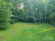 Large grassy backyard with trees at 2222 19Th Ne Ave, Hickory, NC 28601