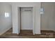 Open shelving and wood louvered doors in bedroom closet at 2222 19Th Ne Ave, Hickory, NC 28601
