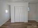 Double-door closet with wood louvered doors in bedroom at 2222 19Th Ne Ave, Hickory, NC 28601