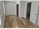 Well-lit bedroom with hardwood floors and access to another room at 2222 19Th Ne Ave, Hickory, NC 28601