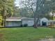Blue house with mature trees and green lawn at 2222 19Th Ne Ave, Hickory, NC 28601