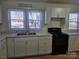 White kitchen with black appliances and L shape design at 2222 19Th Ne Ave, Hickory, NC 28601