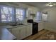 Bright kitchen featuring white cabinets and new flooring at 2222 19Th Ne Ave, Hickory, NC 28601