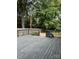 View of the deck with a dark-colored railing, as well as a partial view of the backyard at 3329 Draper Ave, Charlotte, NC 28205