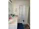 Functional bathroom with double sinks, neutral walls, and tile flooring, providing a clean and efficient space at 3329 Draper Ave, Charlotte, NC 28205