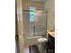 Small bathroom with a combination shower and tub, a toilet, a tiled floor and shower surround, and a vanity at 3329 Draper Ave, Charlotte, NC 28205