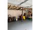 Unfinished garage featuring a concrete floor, exposed insulation, and storage area at 3329 Draper Ave, Charlotte, NC 28205