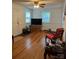 Comfortable living area with hardwood floors, natural light, and a ceiling fan, providing a relaxing atmosphere at 3329 Draper Ave, Charlotte, NC 28205