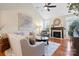 Living Room with hardwood floors, fireplace and ceiling fan at 8219 Bridgegate Dr, Huntersville, NC 28078