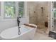 Modern bathroom featuring a freestanding tub and walk-in shower at 859 Irish Creek Dr, Landis, NC 28088