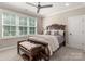 Spacious bedroom with a comfortable bed and large windows at 859 Irish Creek Dr, Landis, NC 28088