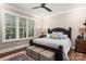 Spacious bedroom with a king-size bed, plenty of natural light and wood floors at 859 Irish Creek Dr, Landis, NC 28088