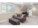 Comfortable sitting area with couch and ottoman, plus a work station at 859 Irish Creek Dr, Landis, NC 28088