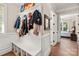 Convenient entryway with built-in bench, coat hooks, and access to other rooms at 859 Irish Creek Dr, Landis, NC 28088