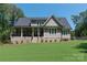 House exterior showcasing a large backyard and beautiful landscaping at 859 Irish Creek Dr, Landis, NC 28088