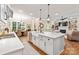 Open concept kitchen with island, stainless steel appliances, and hardwood floors at 859 Irish Creek Dr, Landis, NC 28088