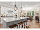 Modern kitchen with large island and white cabinets at 859 Irish Creek Dr, Landis, NC 28088