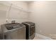 Laundry room with stacked washer and dryer and shelving at 859 Irish Creek Dr, Landis, NC 28088