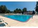 Community swimming pool with lounge chairs at 859 Irish Creek Dr, Landis, NC 28088